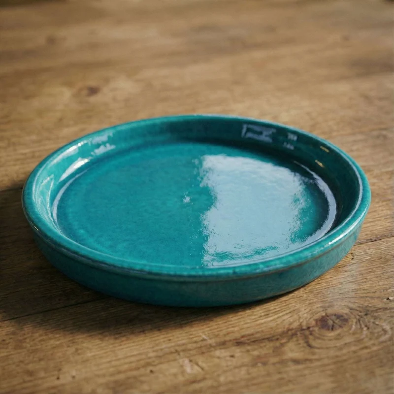 Soucoupe 29cm turquoise faite à la main en terre cuite émaillée