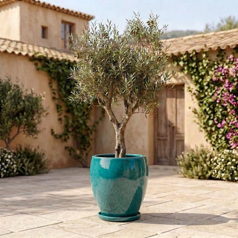 Soucoupe 24cm turquoise faite à la main en terre cuite émaillée